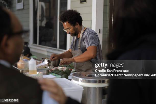 Chef Ravi Kapur prepares a poke dish at his pop up restaurant at Bloodhound Bar on Thursday. Kapur is holding a restaurant pop up called Paniolo...