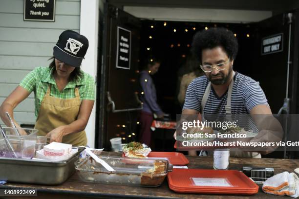 Chef Ravi Kapur, and his assistant chef, Nana Guardia, left, prepare Hawaiian inspired dishes during Kapur's restaurant pop up called Paniolo Social...