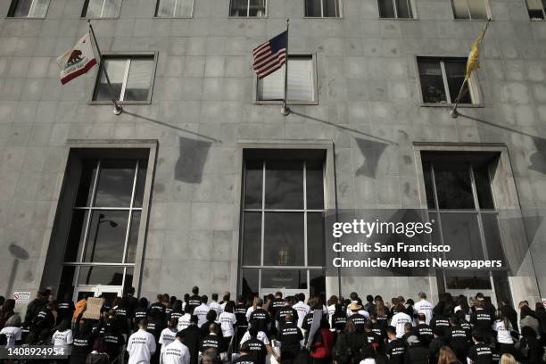 San Francisco Public Defender Jeff Adachi and several lawyers from his office, along with supportive attorneys, have a moment of silence as they held...