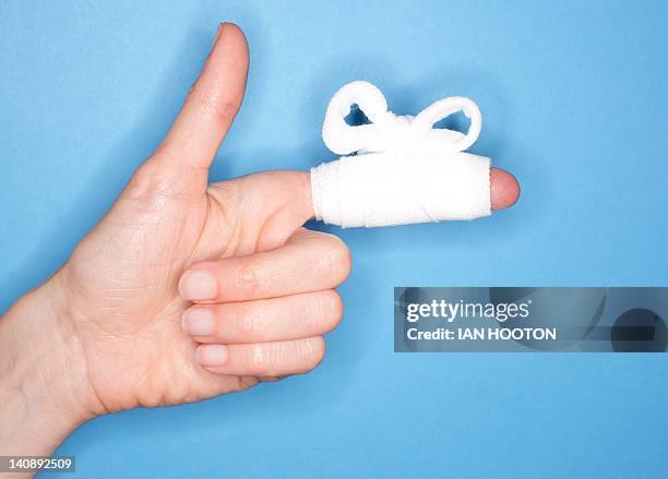 bandaged finger - hand laceration stock pictures, royalty-free photos & images