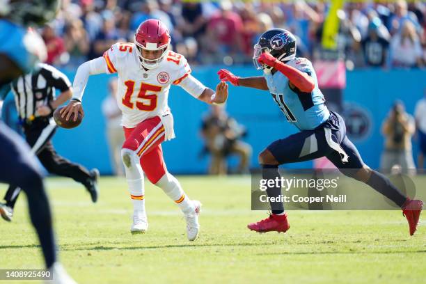 Patrick Mahomes of the Kansas City Chiefs attempts to stiff-arm Kevin Byard of the Tennessee Titans during an NFL game at Nissan Stadium on October...