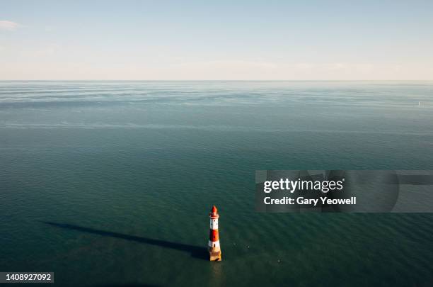 beachy head lighthouse at sunset - beachy head stock pictures, royalty-free photos & images