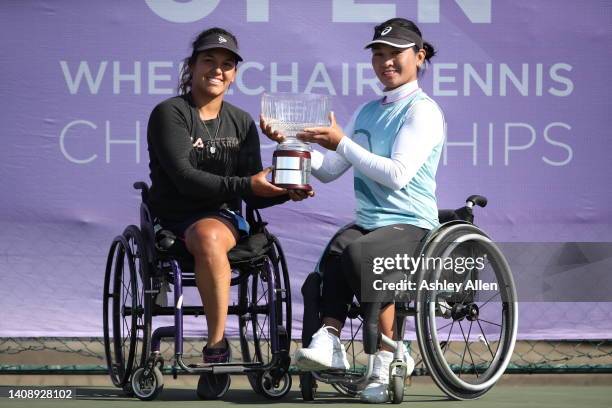 Maria Florencia Moreno of Argentina and Zhenzhen Zhu of China pose with the winner's trophy after winning the Women's Double's final match against...