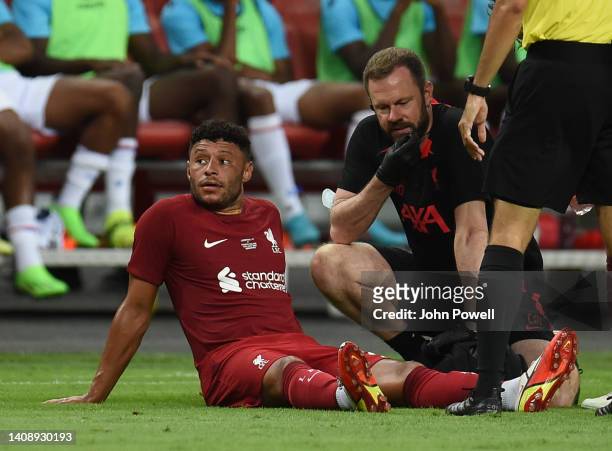 Alex Oxlade-Chamberlain of Liverpool goes off in action jured during the preseason friendly between Liverpool v Crystal Palace at National Stadium on...
