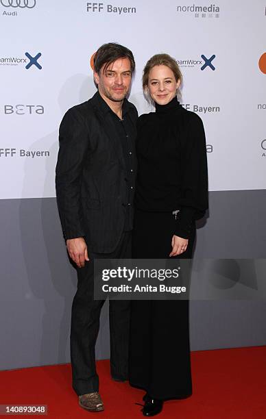 Actress Bernadette Heerwagen and her husband Ole Puppe attend the "Muenchen 72 - Das Attentat" Germany Premiere at Astor Film Lounge on March 7, 2012...