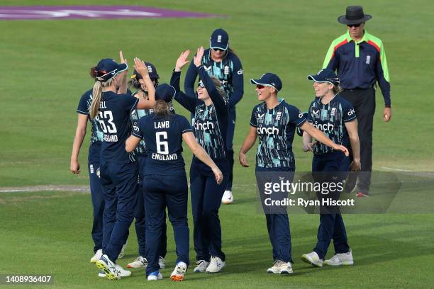 Lauren Bell of England celebrates with teammates after catching out Sune Luus of South Africa during the 2nd Royal London Series One Day...