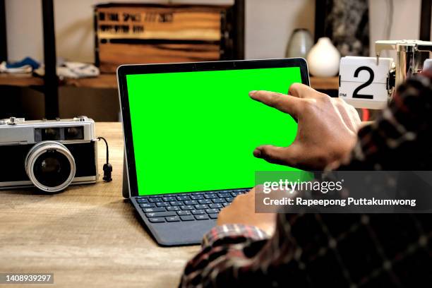 male photographer working in his office. retouching pictures on computer - retouched image stock pictures, royalty-free photos & images