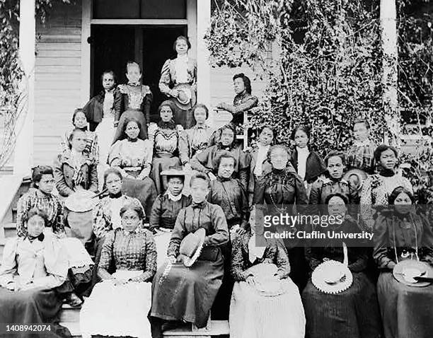 Group of young women pose in front of the Simpson Industrial Home at Claflin College in Orangeburg, South Carolina