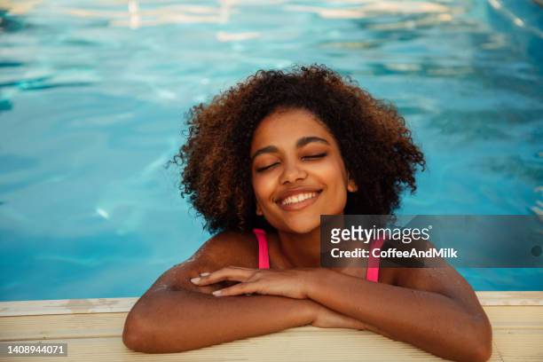 portrait of a fresh and lovely woman in the pool - poolside glamour stock pictures, royalty-free photos & images