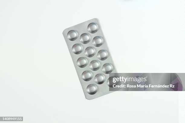 one pill blisters on white background - blister stockfoto's en -beelden