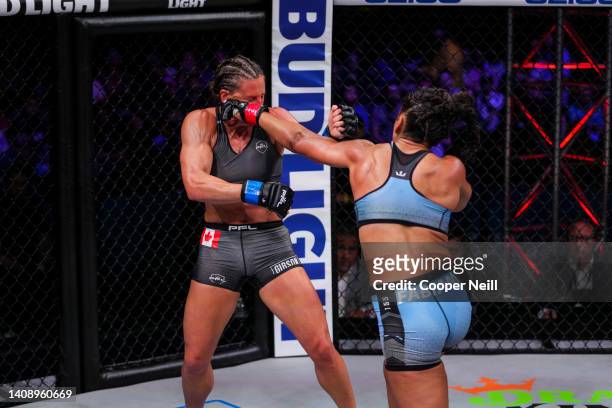 Genah Fabian connects with a punch against Julia Budd during PFL 3 at the Esports Stadium Arlington on May 6, 2022 in Arlington, Texas.