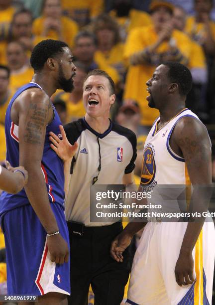 Deandre Jordan , left, and Draymond Green are separated by a referee as they have words in the second half as the Clippers defeated the Warriors...