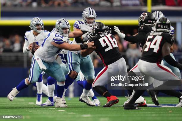 Tyler Biadasz of the Dallas Cowboys defends against Atlanta Falcons defensive tackle Tyeler Davison during an NFL game at AT&T Stadium on November...