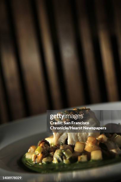 The Wild striped bass with mussel potato chowder and parsley coulis served at Redd Restaurant in Yountville, Calif., on Thursday, March 31, 2016....