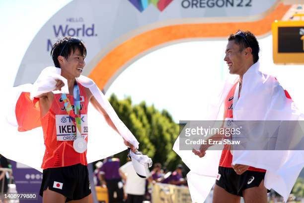Silver medalist Koki Ikeda of Team Japan and gold medalist Toshikazu Yamanishi of Team Japan celebrate following the Men’s 20 Kilometres Race Walk on...