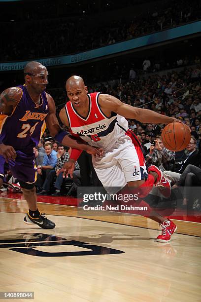 Maurice Evans of the Washington Wizards drives against Kobe Bryant of the Los Angeles Lakers during the game at the Verizon Center on March 7, 2012...