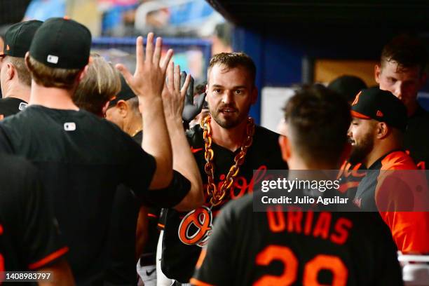 Trey Mancini of the Baltimore Orioles celebrates with teammates after hitting a home run in the third inning against the Tampa Bay Rays at Tropicana...