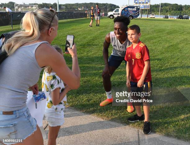 Albert Sambi Lokonga of Arsenal has his picture taken with a young fan after the Arsenal training session on July 15, 2022 in Annapolis, Maryland.