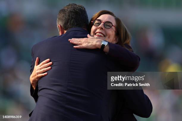 Governor of Oregon Kate Brown and second gentleman of the United States Douglas Emhoff hug during the Opening Ceremony on day one on of the World...