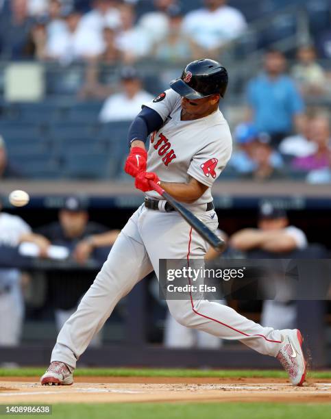 Rafael Devers of the Boston Red Sox hits a two run home run in the first inning against the New York Yankees at Yankee Stadium on July 15, 2022 in...