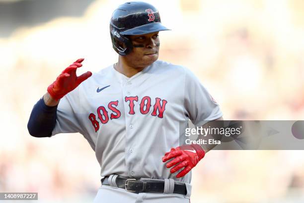 Rafael Devers of the Boston Red Sox rounds the bases after he hit a two run home run in the first inning against the New York Yankees at Yankee...