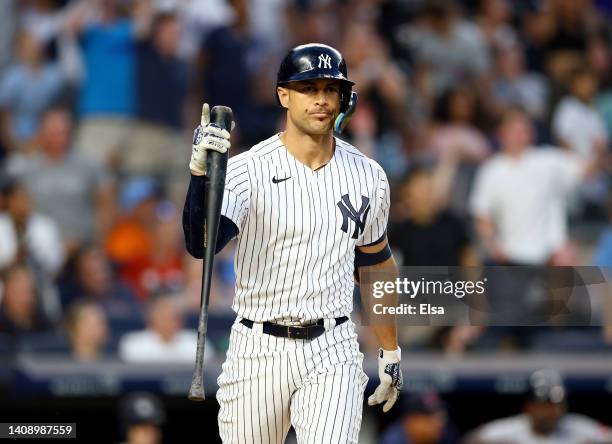 Giancarlo Stanton of the New York Yankees reacts after he hit a three run home run in the third inning against the Boston Red Sox at Yankee Stadium...