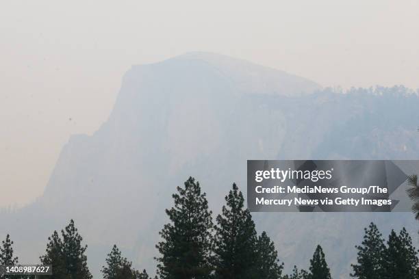 The Half Dome is hardly visible due to the smoky skies from the Washburn Fire seen from the Yosemite National Park in Yosemite, Calif., on Monday,...