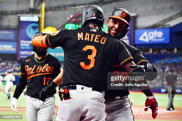 Ramon Urias of the Baltimore Orioles celebrates with Jorge Mateo after hitting a home run in the fourth inning against the Tampa Bay Rays at...