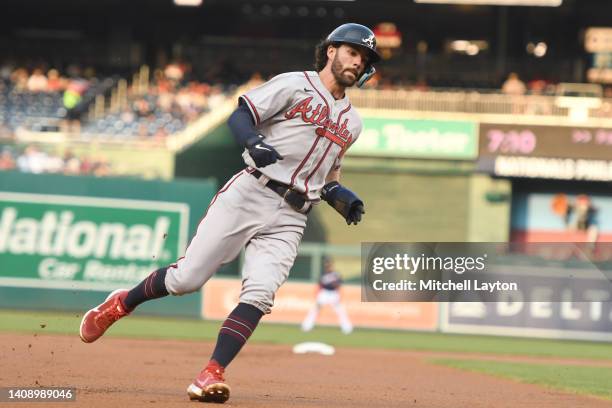 Dansby Swanson of the Atlanta Braves runs home on a Matt Olson hit in the first inning during a baseball game against the Washington Nationals at...