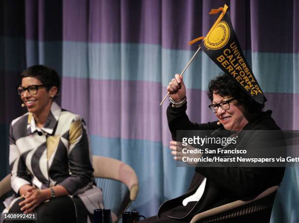 Associate Supreme Court Justice Sonia Sotomayor waves a Cal penant after conversation with Melissa Murray, Interim Dean UC Berkeley School of Law at...