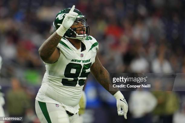 Quinnen Williams of the New York Jets celebrates against the Houston Texans during an NFL game at NRG Stadium on November 28, 2021 in Houston, Texas.
