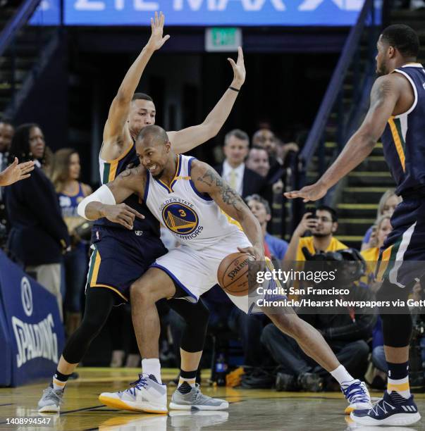 Golden State Warriors' David West tries to get past Utah Jazz' Dante Exum in the second quarter during Game 2 of the Western Conference Semifinals...