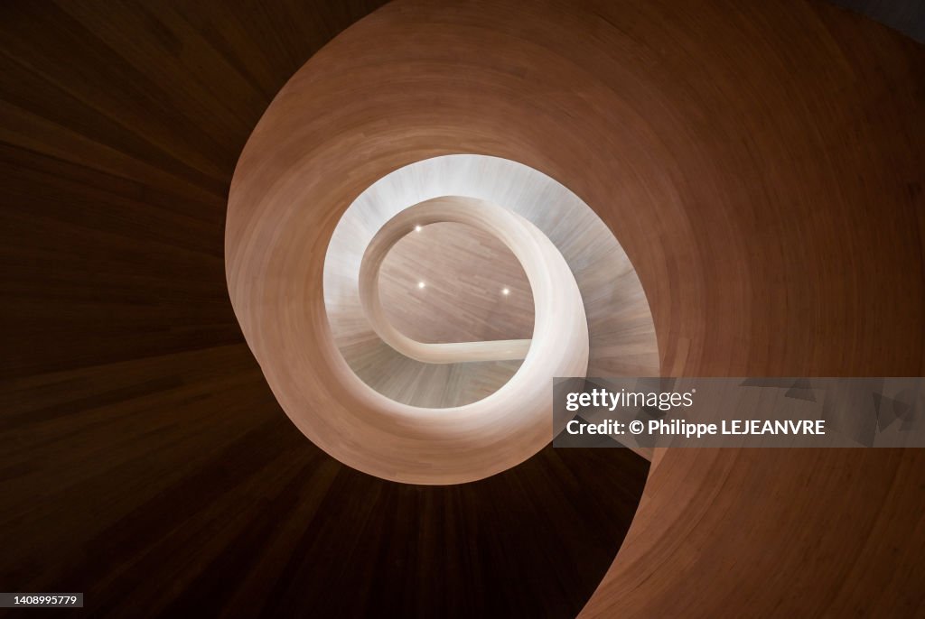 Spiral wooden staircase low angle view