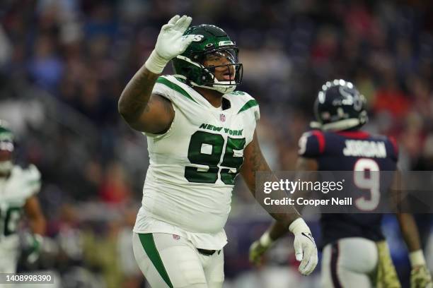 Quinnen Williams of the New York Jets celebrates against the Houston Texans during an NFL game at NRG Stadium on November 28, 2021 in Houston, Texas.