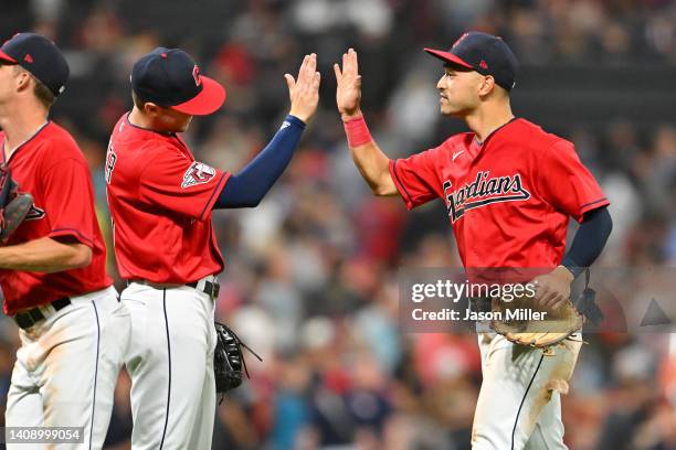 Owen Miller celebrates with Steven Kwan of the Cleveland Guardians after the Guardians defeated the Detroit Tigers 6-5 at Progressive Field on July...