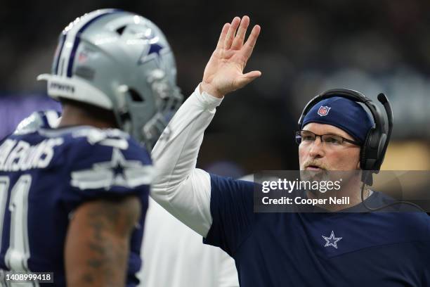 Dallas Cowboys defensive coordinator Dan Quinn celebrates with Micah Parsons of the Dallas Cowboys against the New Orleans Saints during an NFL game...
