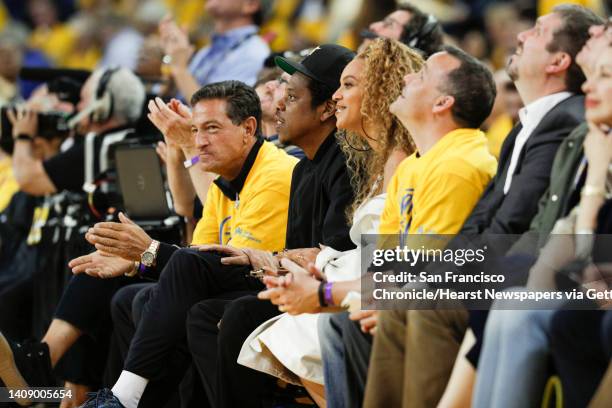 Jay-Z and Beyonce watch the first quarter during game 1 of round 2 of the Western Conference Finals between the Golden State Warriors and the New...