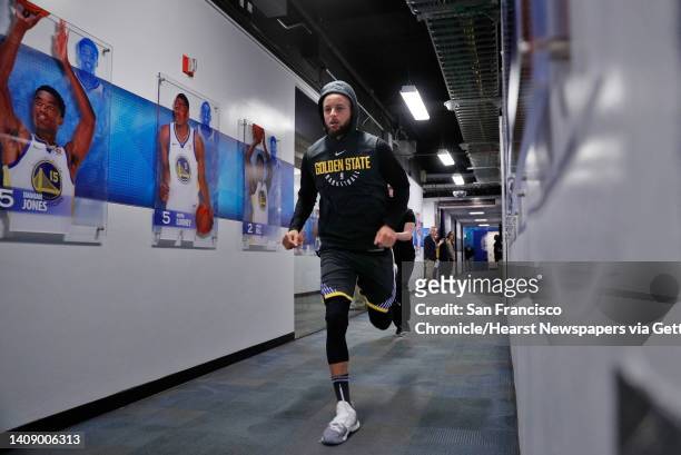 Stephen Curry sprints from the locker room to the court before the Golden State Warriors played the New Orleans Pelicans in Game 2 of the Western...