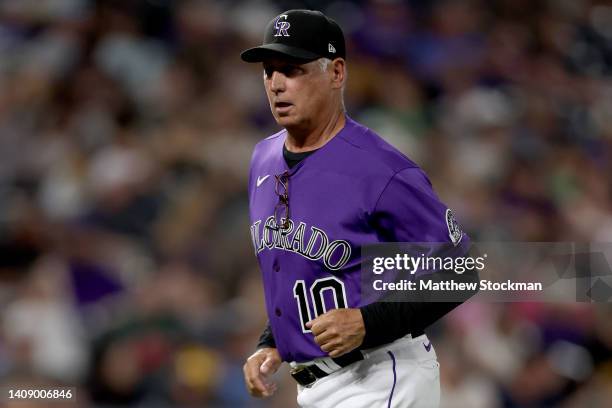 Manager Bud Black of the Colorado Rockies jogs back to the dugout after confer with starting pitcher Germain Marquez after being hit by a batted ball...