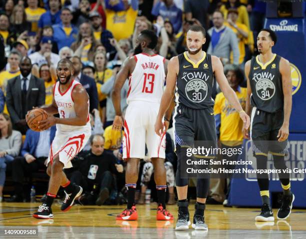 Houston Rockets' Chris Paul reacts before officials called a foul putting .5 seconds back on the game clock during game 4 of the Western Conference...