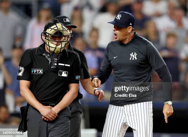 Manager Aaron Boone of the New York Yankees yells at home plate umpire D.J.Reyburn after Boone was tossed from the game in the ninth inning against...