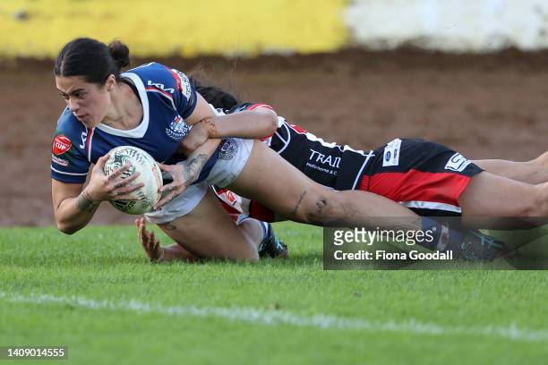 Katelyn Vaha’akolo of Auckland scores a try on debut tackled by Waikohika Flesher of Counties Manukau during the round x Farah Palmer Cup match...
