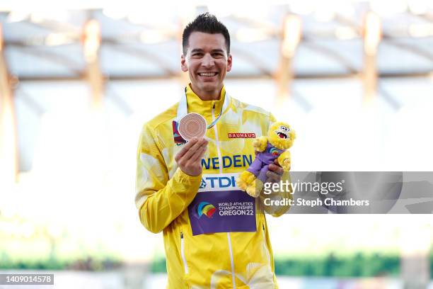 Bronze medalist poses during the medal ceremony for the Men's 20 Kilometer Race Walk Final on day one of the World Athletics Championships Oregon22...
