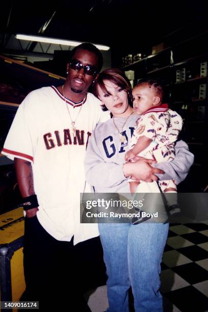 Singer Faith Evans poses for photos with rapper and producer Sean 'Puffy' Combs and Christopher Wallace, Jr., son of rapper Notorious B.I.G. In...
