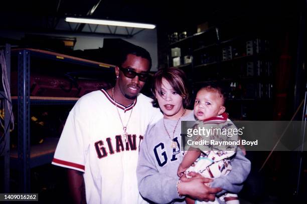Singer Faith Evans poses for photos with rapper and producer Sean 'Puffy' Combs and Christopher Wallace, Jr., son of rapper Notorious B.I.G. In...