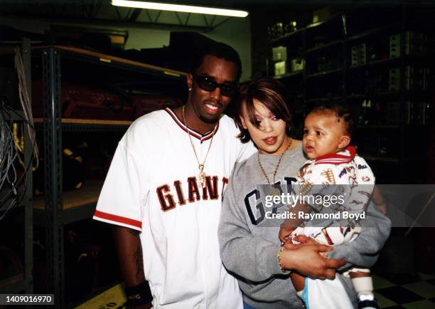 Singer Faith Evans poses for photos with rapper and producer Sean 'Puffy' Combs and Christopher Wallace, Jr., son of rapper Notorious B.I.G. In...