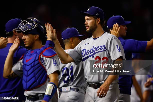 Clayton Kershaw of the Los Angeles Dodgers celebrates a 9-1 win against the Los Angeles Angels at Angel Stadium of Anaheim on July 15, 2022 in...