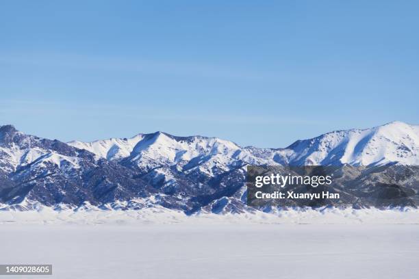 snow capped mountains against the sky - snowfield stock pictures, royalty-free photos & images