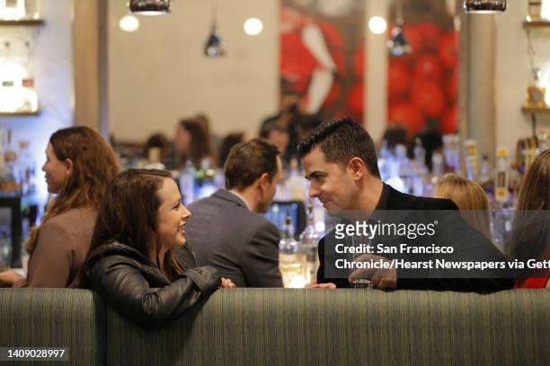 Jenn Collens, left, and Joe DeRose, right, chat during a Three Day Rule matchmaking event at LV Mar Restaurant in Redwood City, Calif., on Wednesday,...