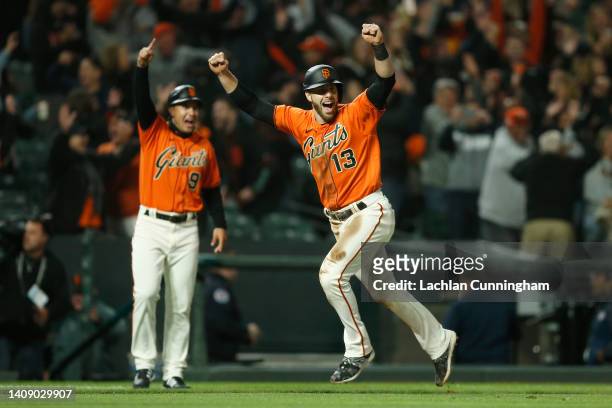Austin Slater of the San Francisco Giants celebrates as he rounds the bases to score on a walk-off grand slam hit by Mike Yastrzemski in the bottom...